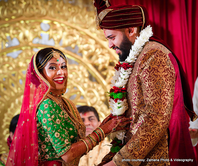 Indian Bride and Groom Enjoying Wedding Rituals 